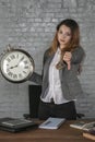 Business woman holds watch and shows thumb down Royalty Free Stock Photo