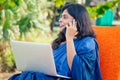 Business woman india asian female freelancer sitting in cafe. woman in indian blue stylish saree sari working on laptop Royalty Free Stock Photo