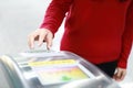 Woman hand traffic card insert ticket to ticket entrance train station