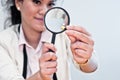 Business woman inspect medicine with magnifier