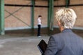 Business woman is inspecting a warehouse