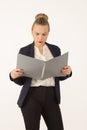 Business woman in a jacket with a folder in hands Royalty Free Stock Photo