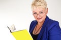 Business woman in jacket with glasses reading a book Royalty Free Stock Photo