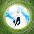 Business woman jumps in rotated field with green grass. Royalty Free Stock Photo