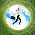 Business woman jumps in rotated field with green grass. Royalty Free Stock Photo