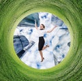 Business woman jumps in rotated green field. Royalty Free Stock Photo
