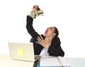 Business woman at laptop computer desk drinking coffee excited and anxious in caffeine addiction Royalty Free Stock Photo