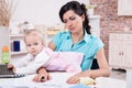 Business woman with laptop and her baby girl Royalty Free Stock Photo
