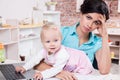 Business woman with laptop and her baby girl Royalty Free Stock Photo