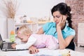 Business woman with laptop and her baby girl Royalty Free Stock Photo