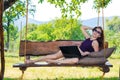 Business woman with laptop outdoors, free space. Royalty Free Stock Photo