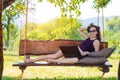 Business woman with laptop outdoors, free space. Royalty Free Stock Photo