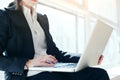 Business woman with laptop working in loft office