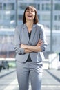 Business woman laughing with arms crossed Royalty Free Stock Photo