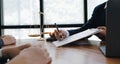 Business woman and lawyers discussing contract papers with brass scale on wooden desk in office. Law, legal services, advice, Royalty Free Stock Photo