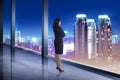 Business woman looking the city from his office room Royalty Free Stock Photo