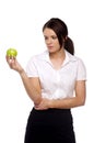 Business woman looking disappointingly at an apple Royalty Free Stock Photo