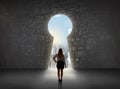 Business woman looking at keyhole with bright cityscape concept Royalty Free Stock Photo