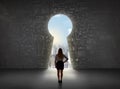 Business woman looking at keyhole with bright cityscape concept Royalty Free Stock Photo
