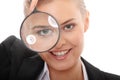 Business woman looking into a magnifying glass Royalty Free Stock Photo
