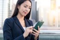 Business woman looking at mobile phone Royalty Free Stock Photo