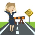 Business woman looking at road sign dead end. Royalty Free Stock Photo