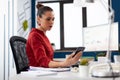 Business woman looking at smartphone screen receiving text message