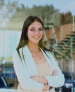 Business woman looking thtough window in the office. Royalty Free Stock Photo