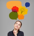 Business woman looking up on idea bulb in color bright bubble Royalty Free Stock Photo