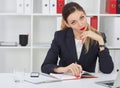 Serious business woman making notes at office workplace. Business job offer, financial success, certified public Royalty Free Stock Photo