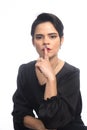 Business woman making silence sign with finger on mouth. Royalty Free Stock Photo