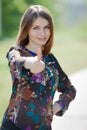 Business woman making a thumb up sign outdoors Royalty Free Stock Photo