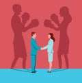 Business woman and man shake hands in workplace while their shadows face each other like boxers