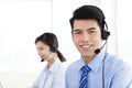 Business Woman and man wearing headset in office Royalty Free Stock Photo