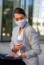 Business woman with mask working on laptop and mobile phone Royalty Free Stock Photo