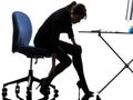 Business woman massaging her leg silhouette Royalty Free Stock Photo