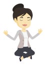 Business woman meditating in lotus position. Royalty Free Stock Photo