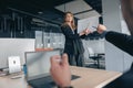 Attractive business woman during meeting showing her project to colleagues Royalty Free Stock Photo