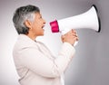 Business woman, megaphone and protest, breaking news or broadcast for gender equality and justice in studio. Serious Royalty Free Stock Photo