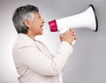 Business woman, megaphone and protest, voice or news and broadcast or announcement on a white background. Mature person Royalty Free Stock Photo