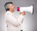 Business woman, megaphone and voice of news, broadcast or sale and announcement on a white background. Mature person Royalty Free Stock Photo