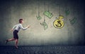 Business woman motivated by money hanging on a fishing hook. Businesswoman running for cash dollar Royalty Free Stock Photo