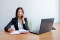 Business woman with notebook, calendar and mobile phone at work. Royalty Free Stock Photo