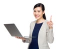 Business woman with notebook computer and finger point up Royalty Free Stock Photo