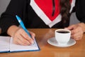 Business woman, notebook, pen and coffee Royalty Free Stock Photo