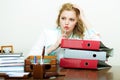 Business woman in office with documents books files folders has a lot of work. Royalty Free Stock Photo