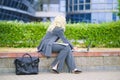 Business woman in an office suit working outside with a laptop computer Royalty Free Stock Photo