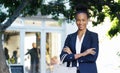 Business woman, outdoor and portrait with arms crossed and confidence in the city. African female person, travel and Royalty Free Stock Photo