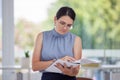 Business woman, paperwork and reading at the office for financial report, analysis or information. Female HR employee Royalty Free Stock Photo