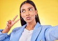 Business woman, peace sign and studio selfie with funny face, pouting and emoji by yellow background. Entrepreneur, hand